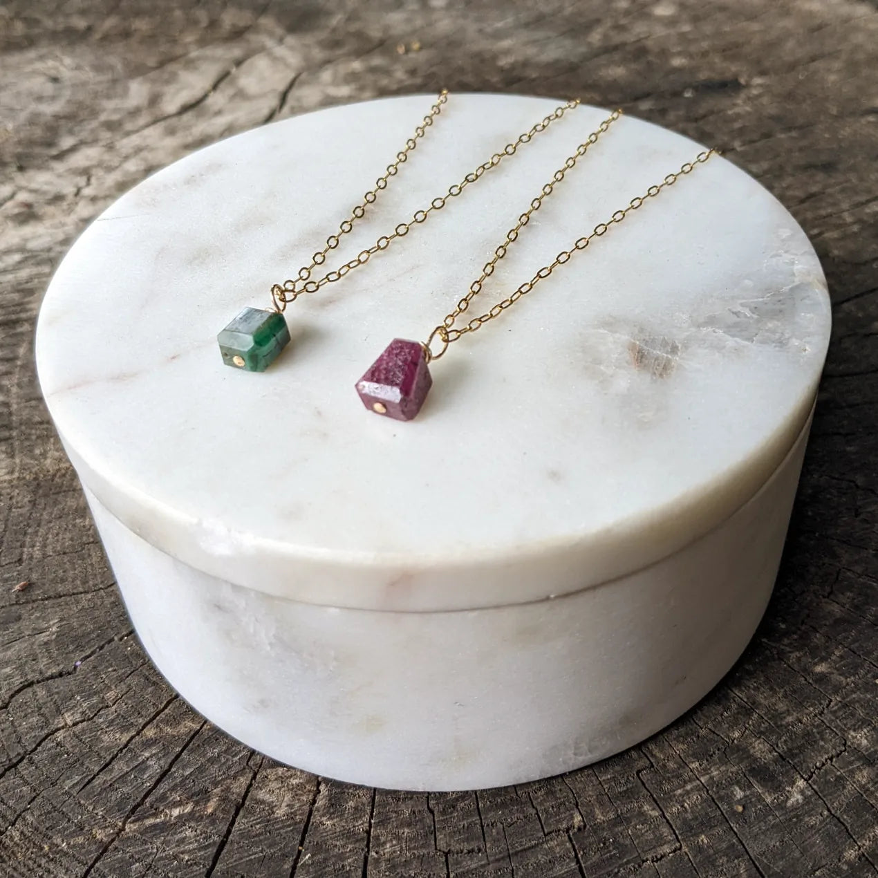 Emerald wire wrapped gold pendant